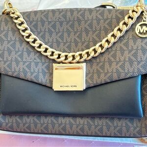 Michael Kors purse.  Brown leather. Separate shoulder strap. Gold clasp & chain.